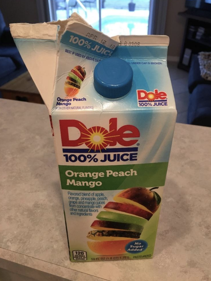 A juice carton opened wrongly