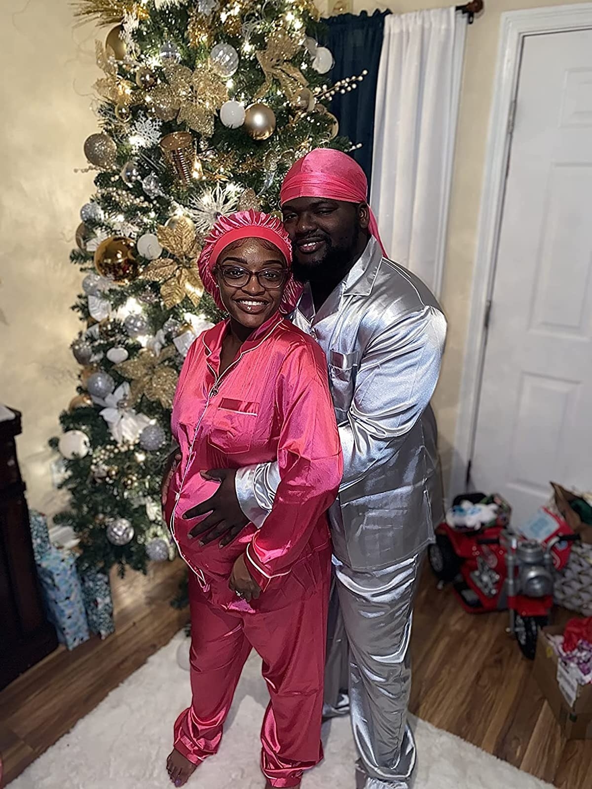 reviewers wearing the pajama sets in pink and silver