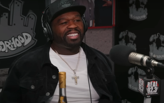 50 Cent smiles during a radio interview