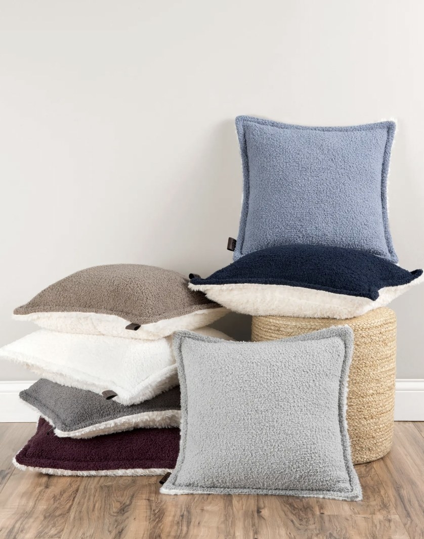 stack of the throw pillows on floor