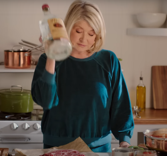 screenshot of ad: martha slamming handle of tito&#x27;s into beef to tenderize it