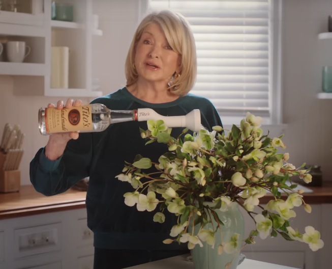 screenshot of ad: martha watering her flowers with tito&#x27;s vodka