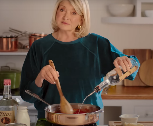 screenshot of ad: martha pouring lots of vodka into her spaghetti sauce