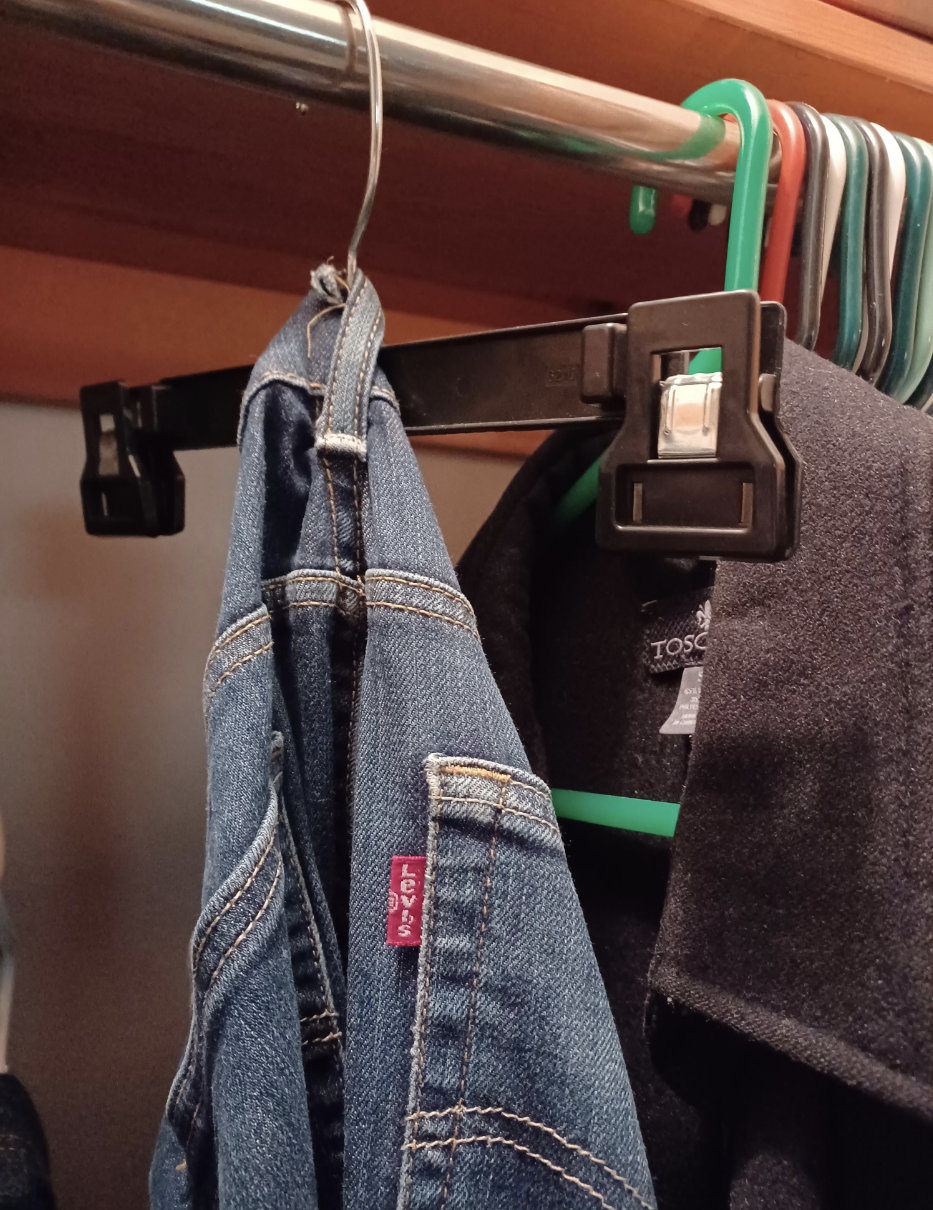 Pants hanging from a hanger
