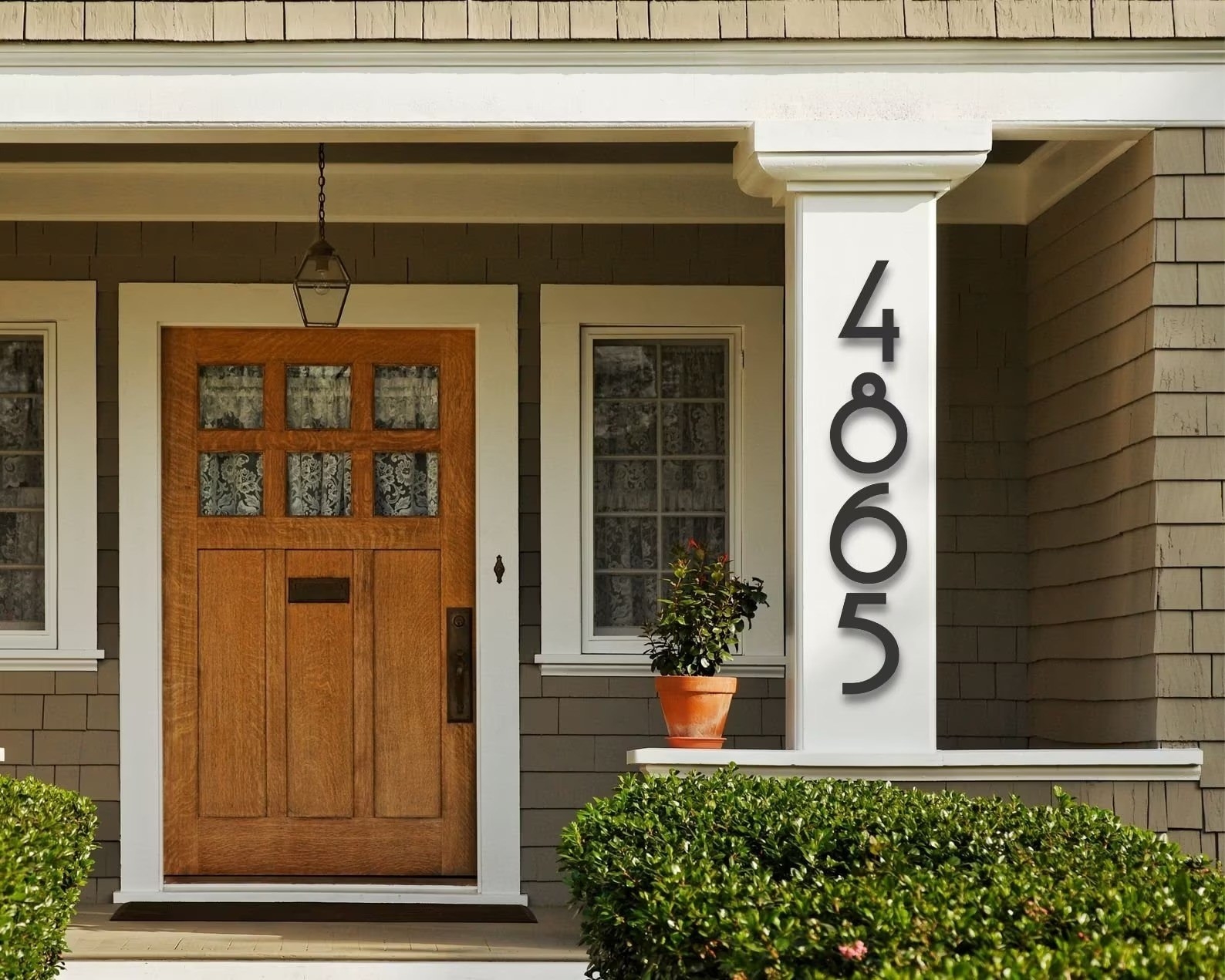 mid century modern numbers on the front of a house