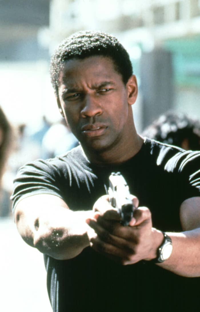 Denzel pointing a gun