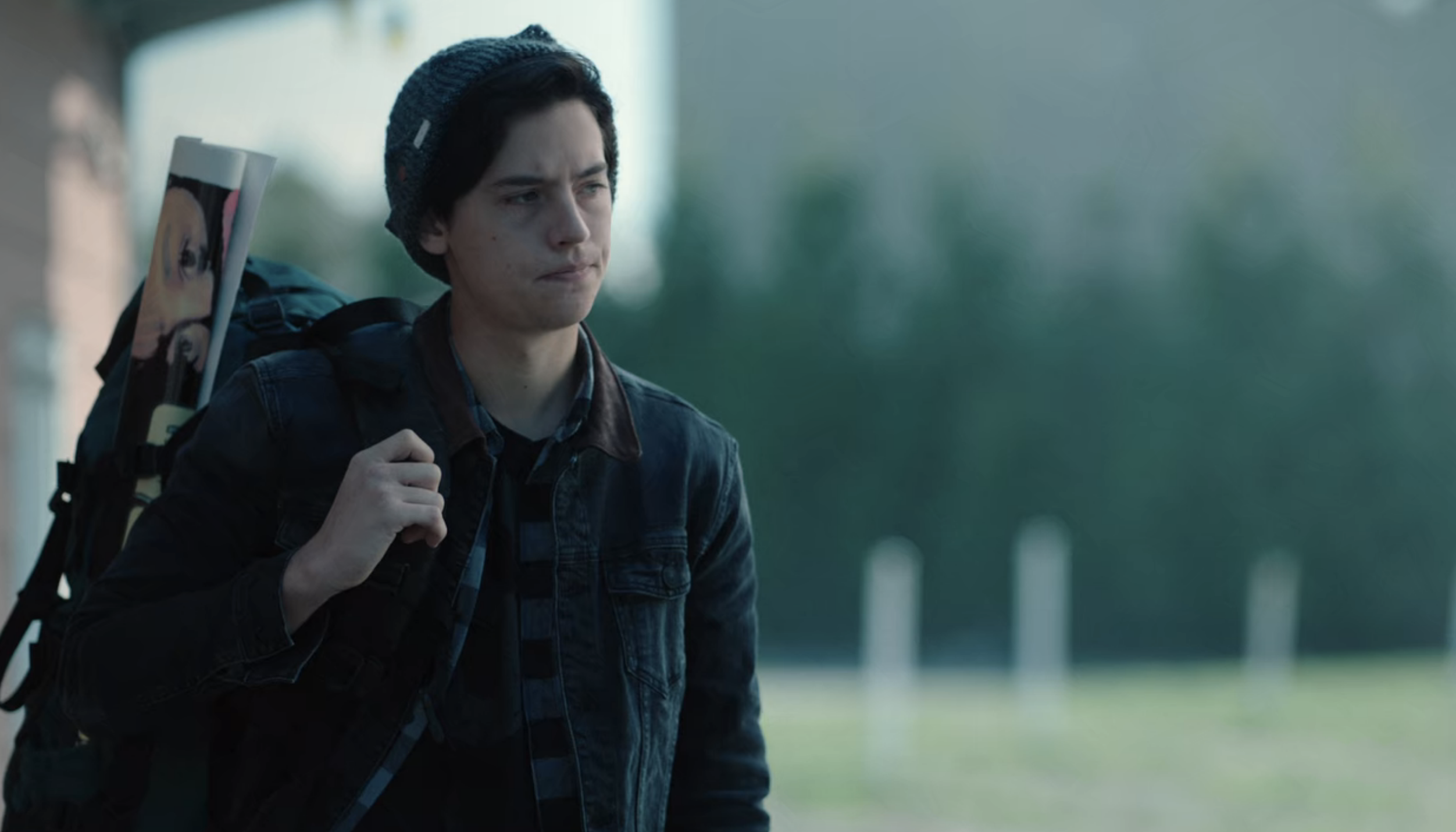 Screenshot from &quot;Riverdale&quot; of a person standing alone and wearing a backpack