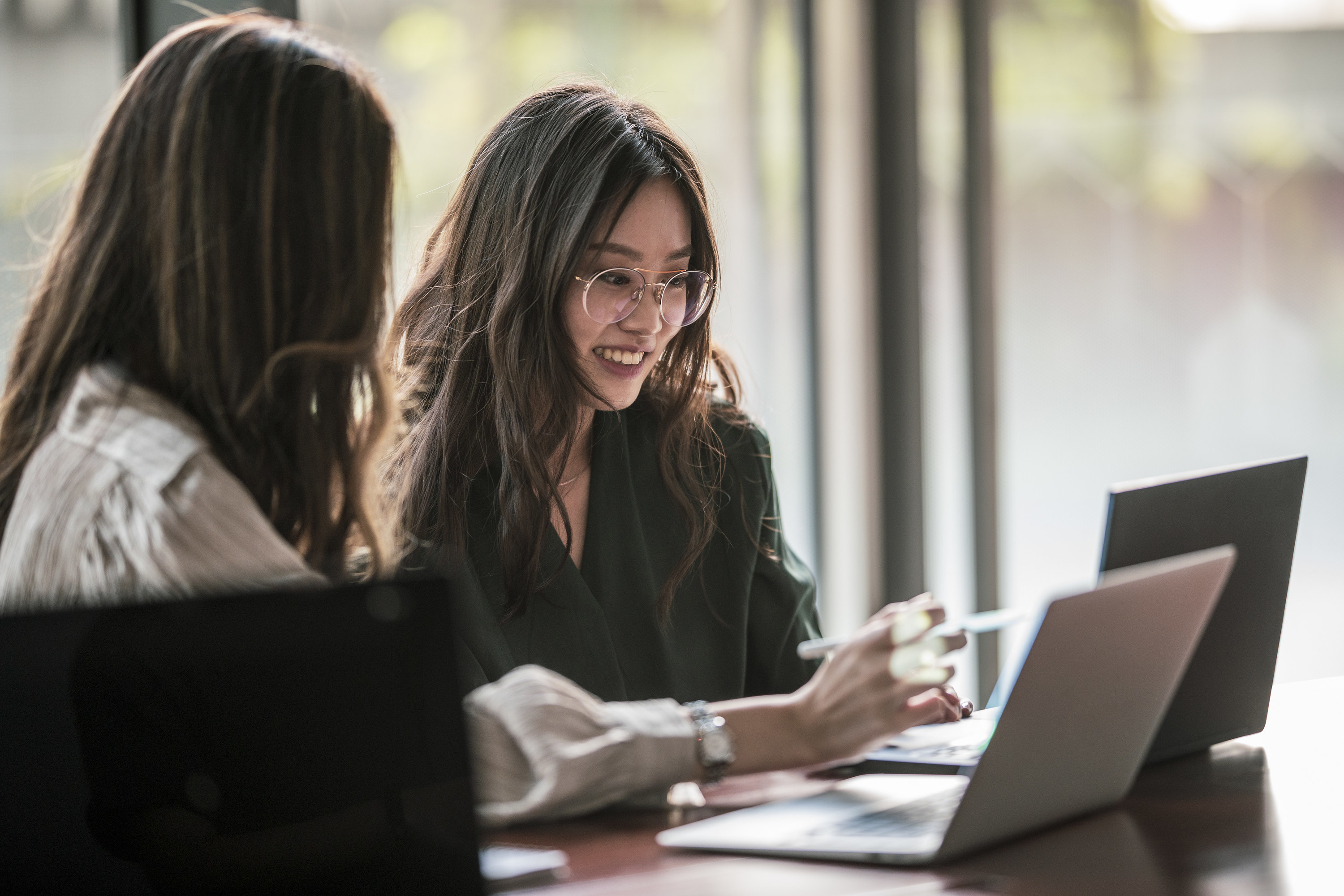 Two women on laptops