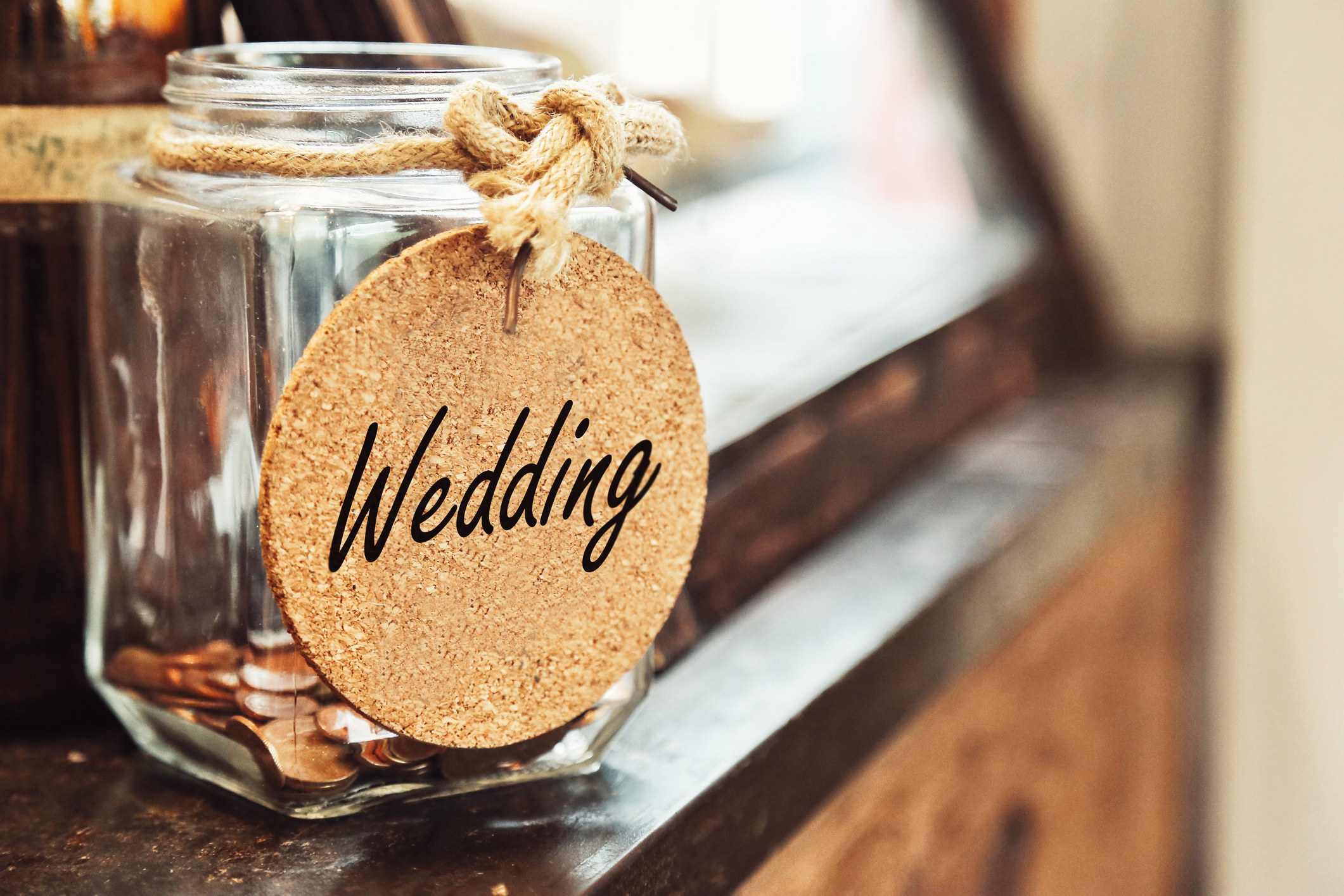 A jar with a &quot;Wedding&quot; label on it
