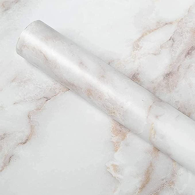 the marble contact paper roll on a counter that has the paper on it