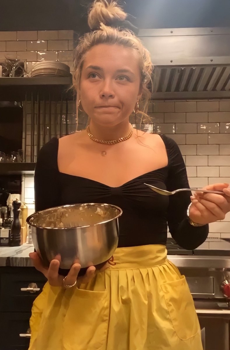 Florence in a kitchen cooking