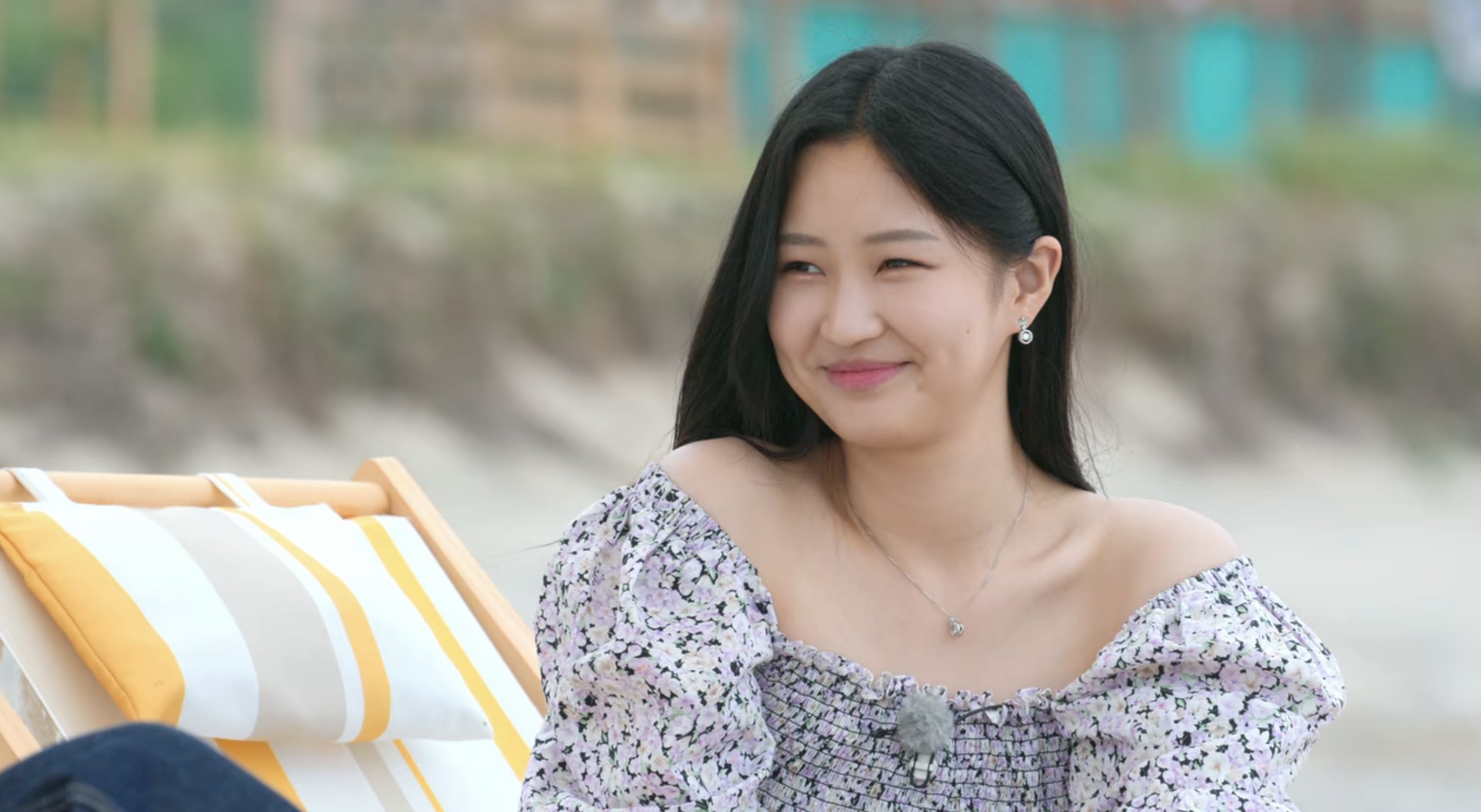 Lim Min-su smiles while sitting on a beach chair