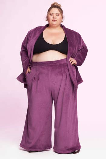 another model wearing the purple trousers