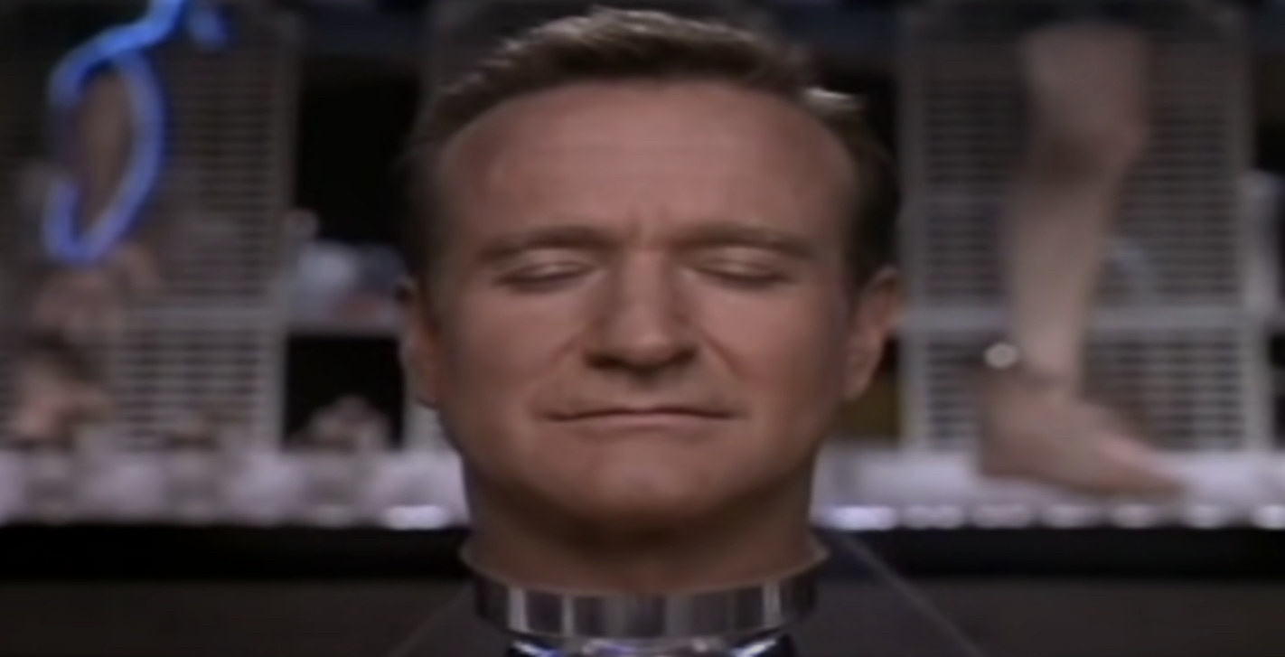 An artificial intelligence head that looks like Robin Williams with his eyes closed