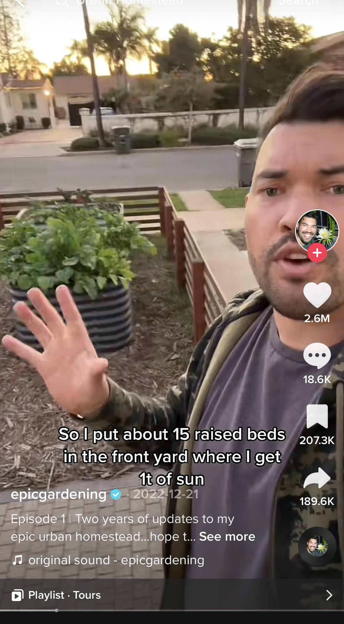 Kevin in his front yard showing the raised garden beds
