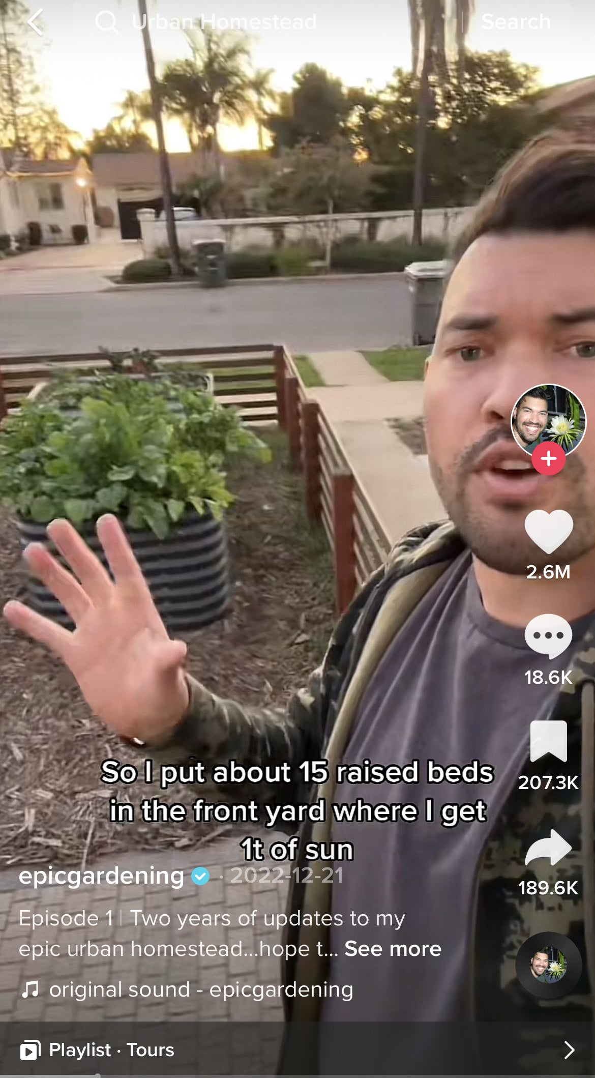 Kevin in his front yard showing the raised garden beds