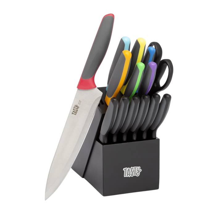 knife set with rainbow multicolored handles in a black tasty-branded knife block