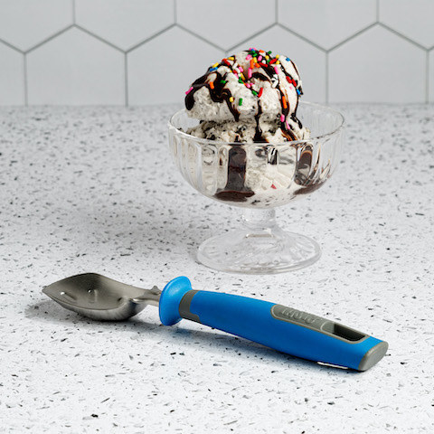 slightly curved and textured ice cream scoop with a blue handle