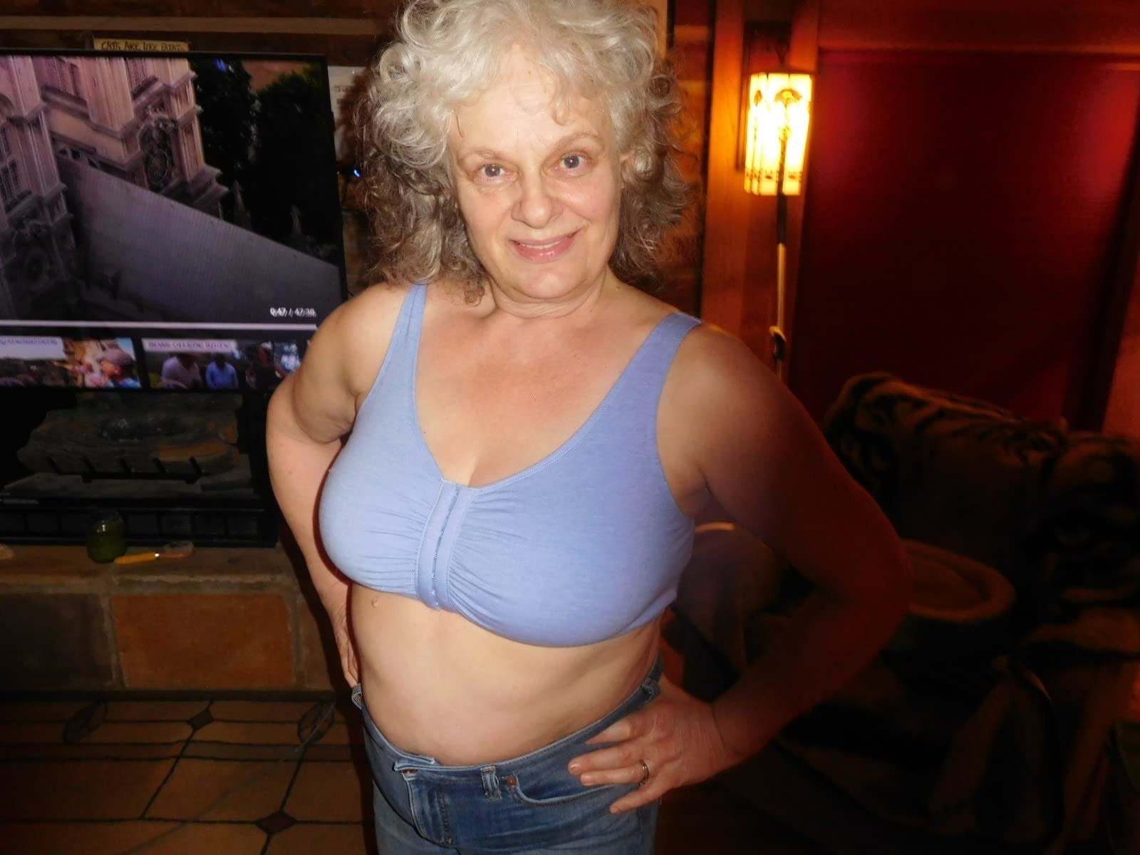 Reviewer posing with hand on hip in purple front-closure bra