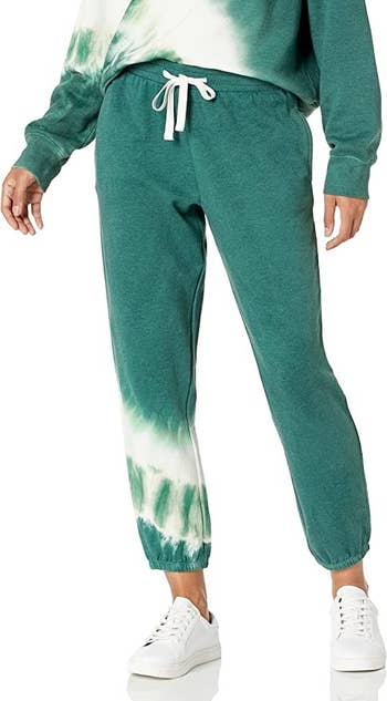 model wearing the green sweatpants