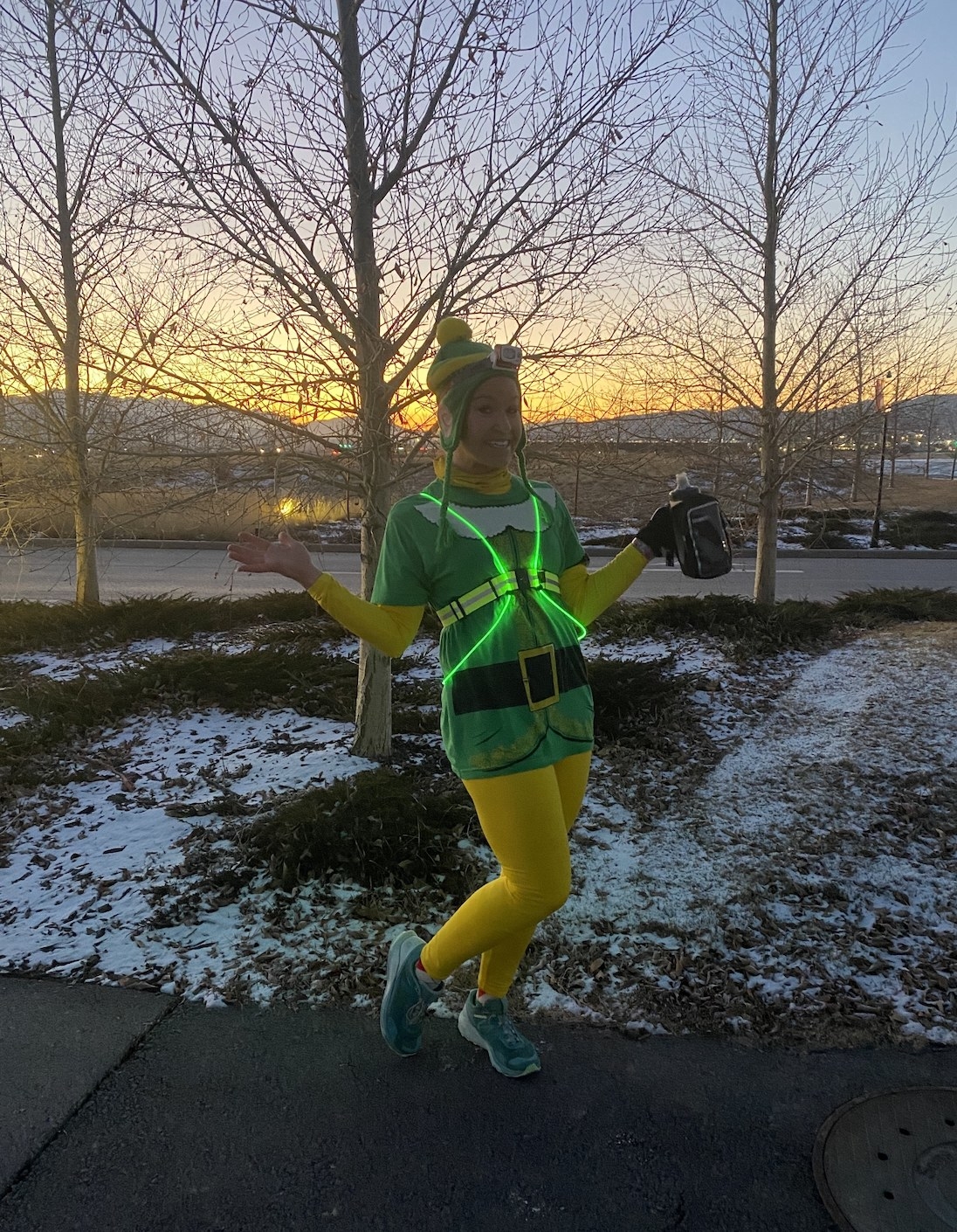 reviewer in yellow thermal underwear and shirt with elf design on the front
