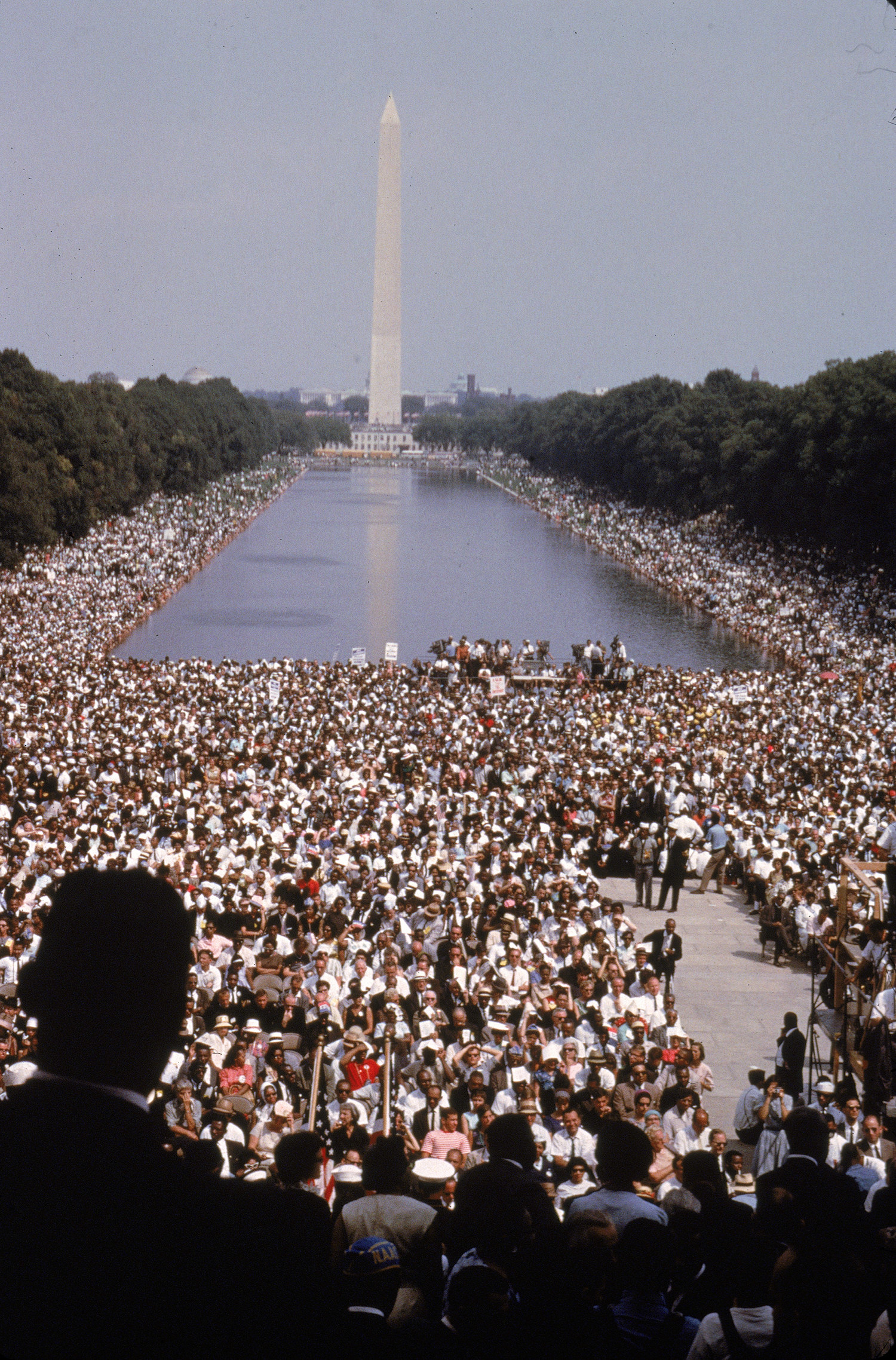 A general view of the large crowd around the Washington Monument and reflecting pool.