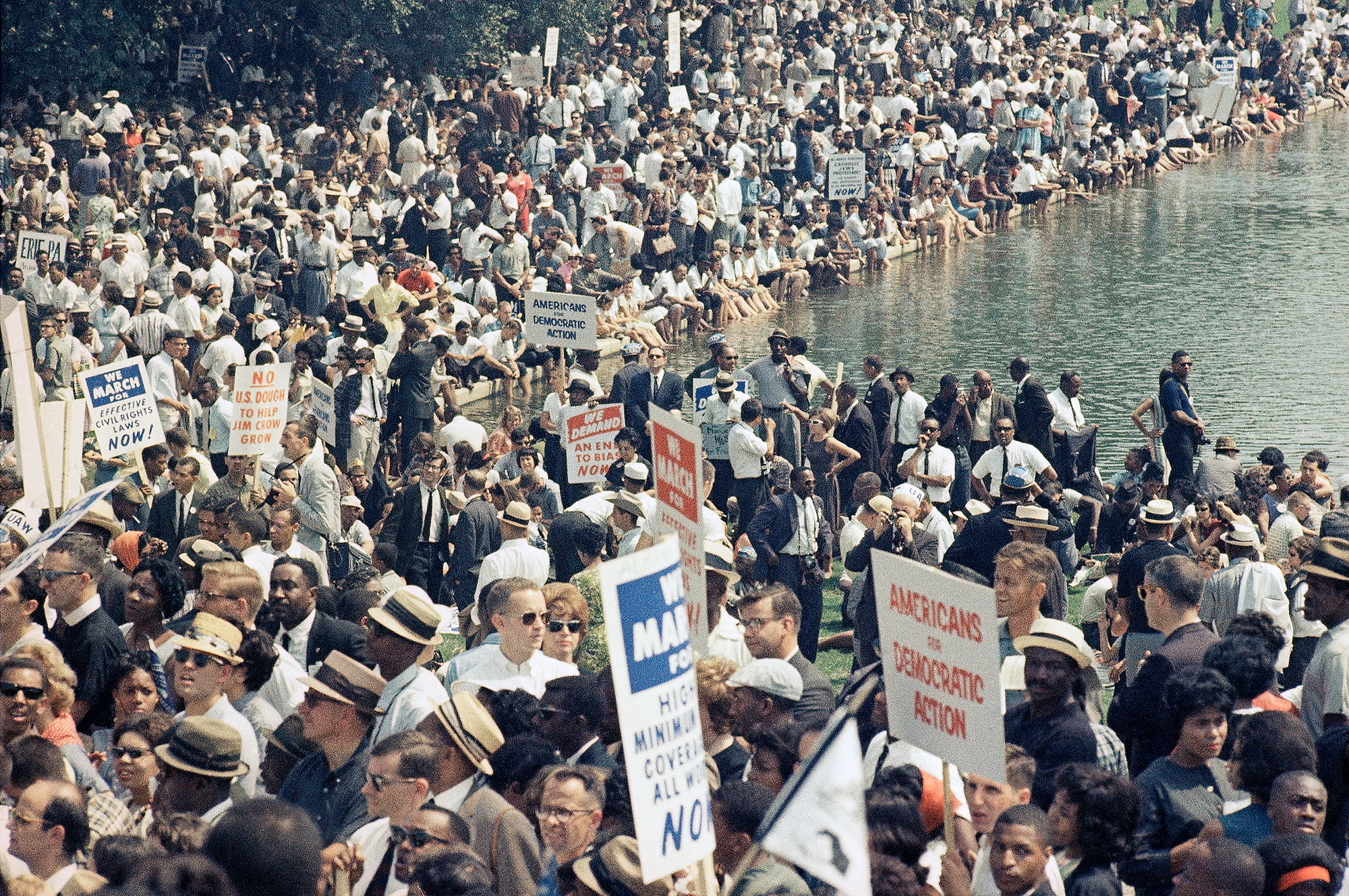 Attendees of the March on Washington crowd around the Lincoln Memorial Reflecting Pool.