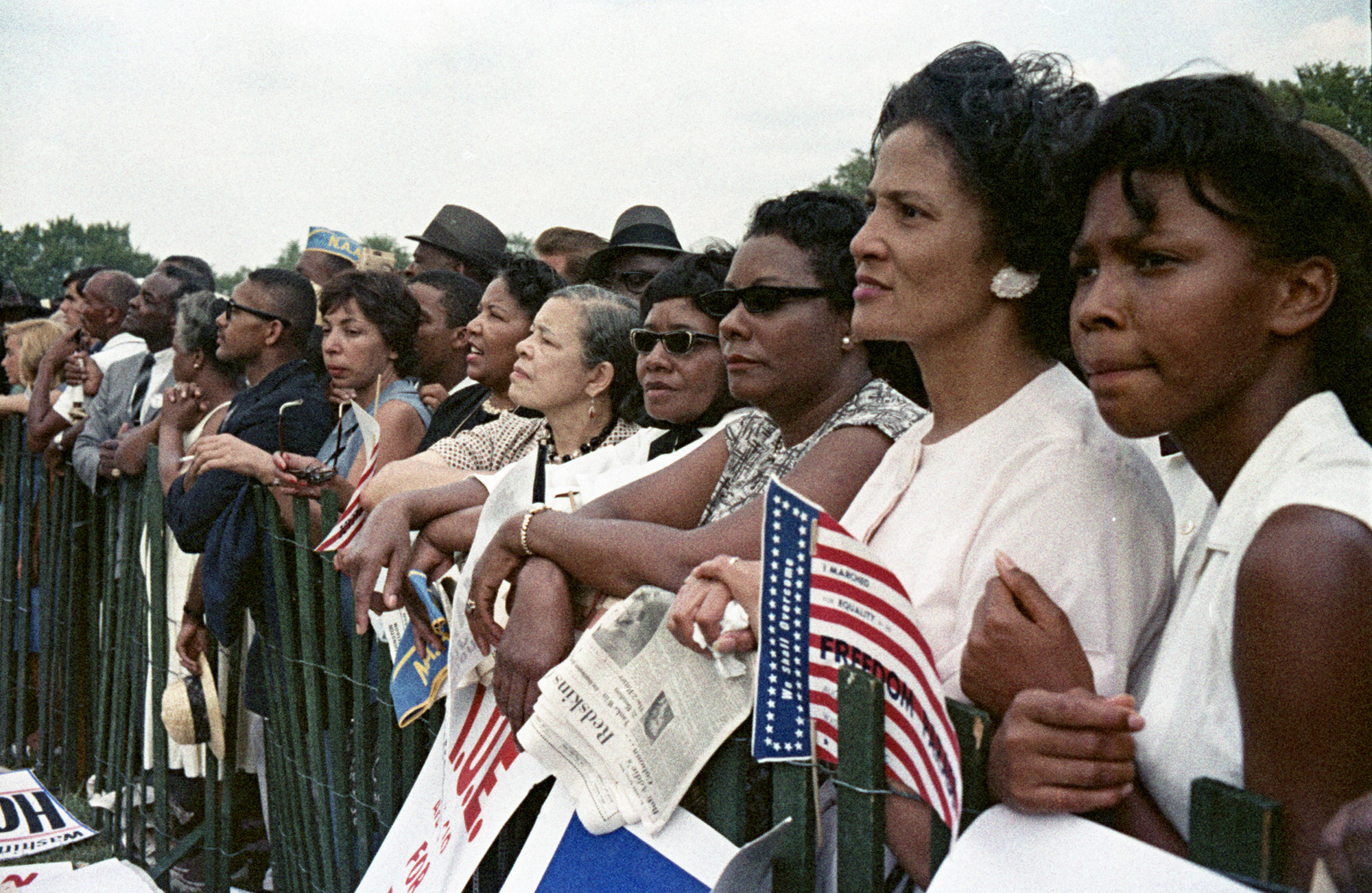 Attendees of the March on Washington are pictured with solemn faces.