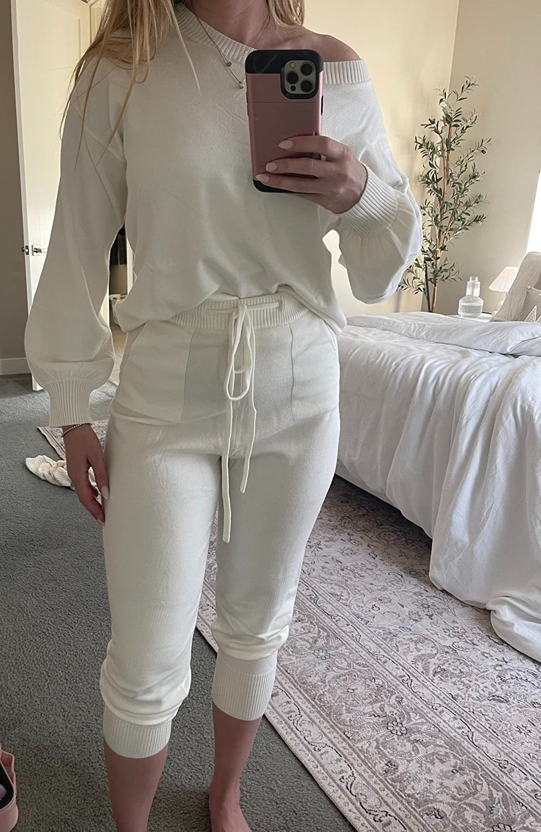 a reviewer wearing the cream colored set