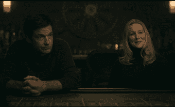 his character sits very still at the bar while another woman talks