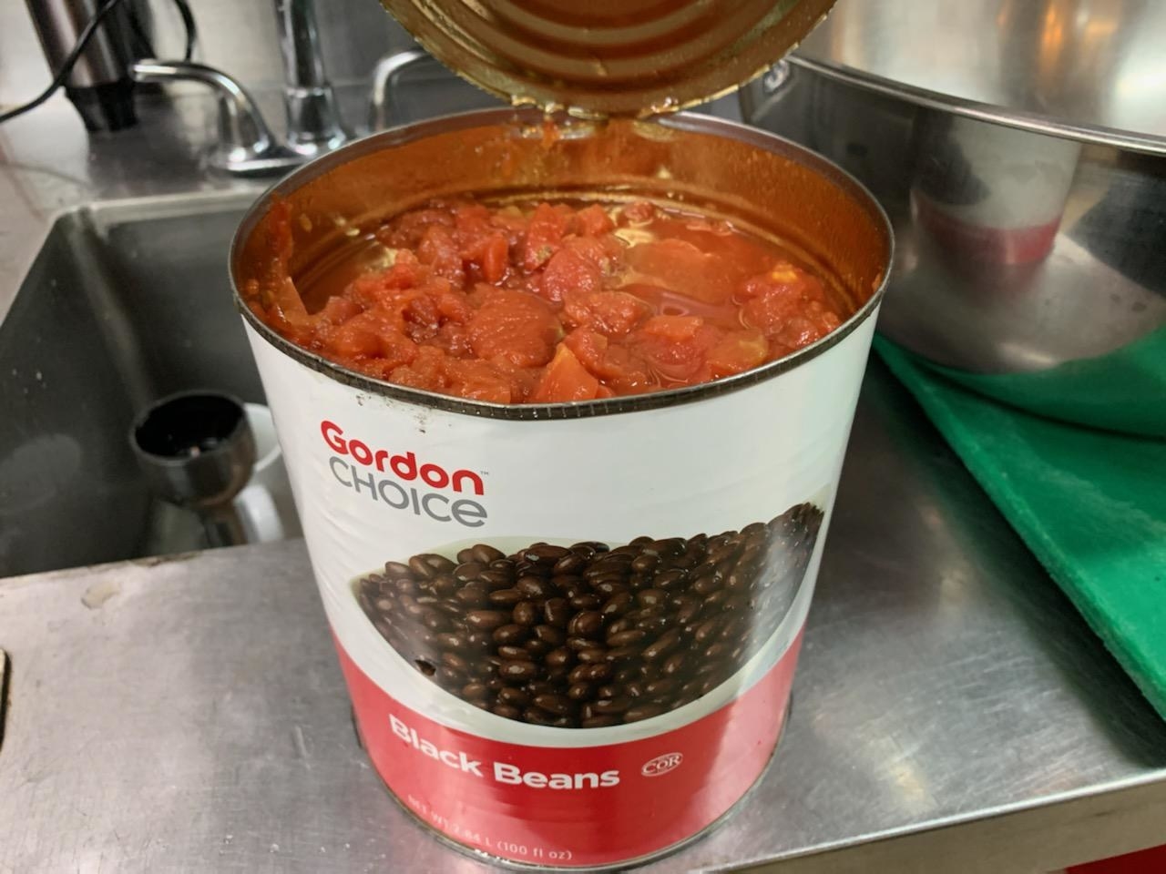 Red beans inside a ban labeled &quot;Black beans&quot;