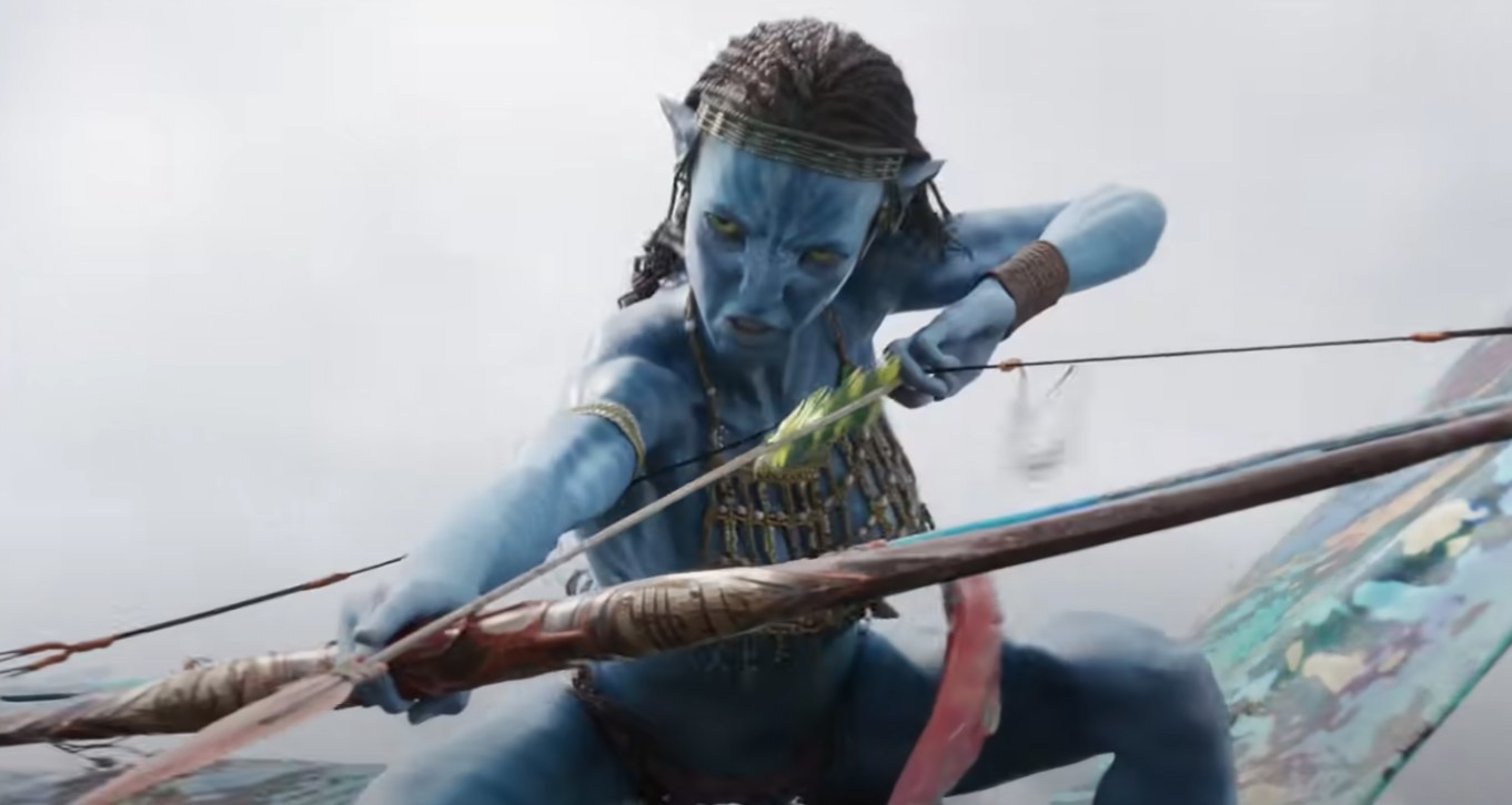 Zoe Saldaña as a Na&#x27;vi character in Avatar 2 donned in costume accessories