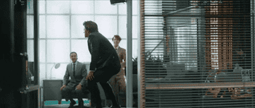 person twerking on a table in an office