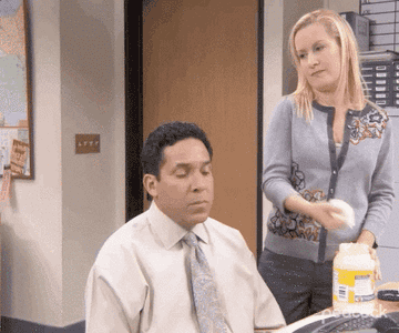 angela slapping mayo on oscar&#x27;s hair in the office