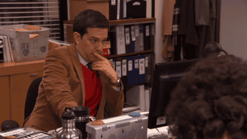 andy booting up his computer on the office