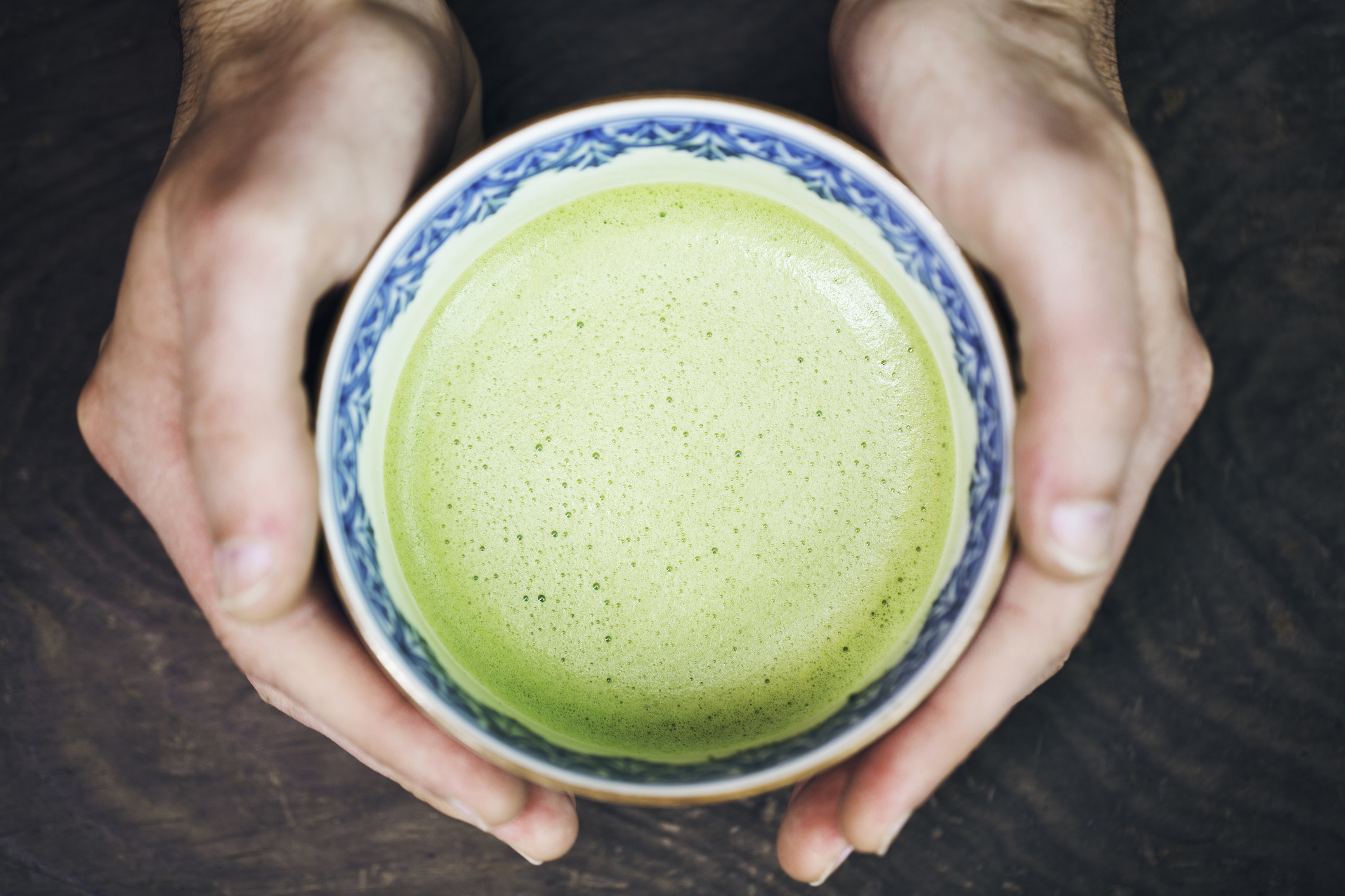 A cup of a hot matcha drink