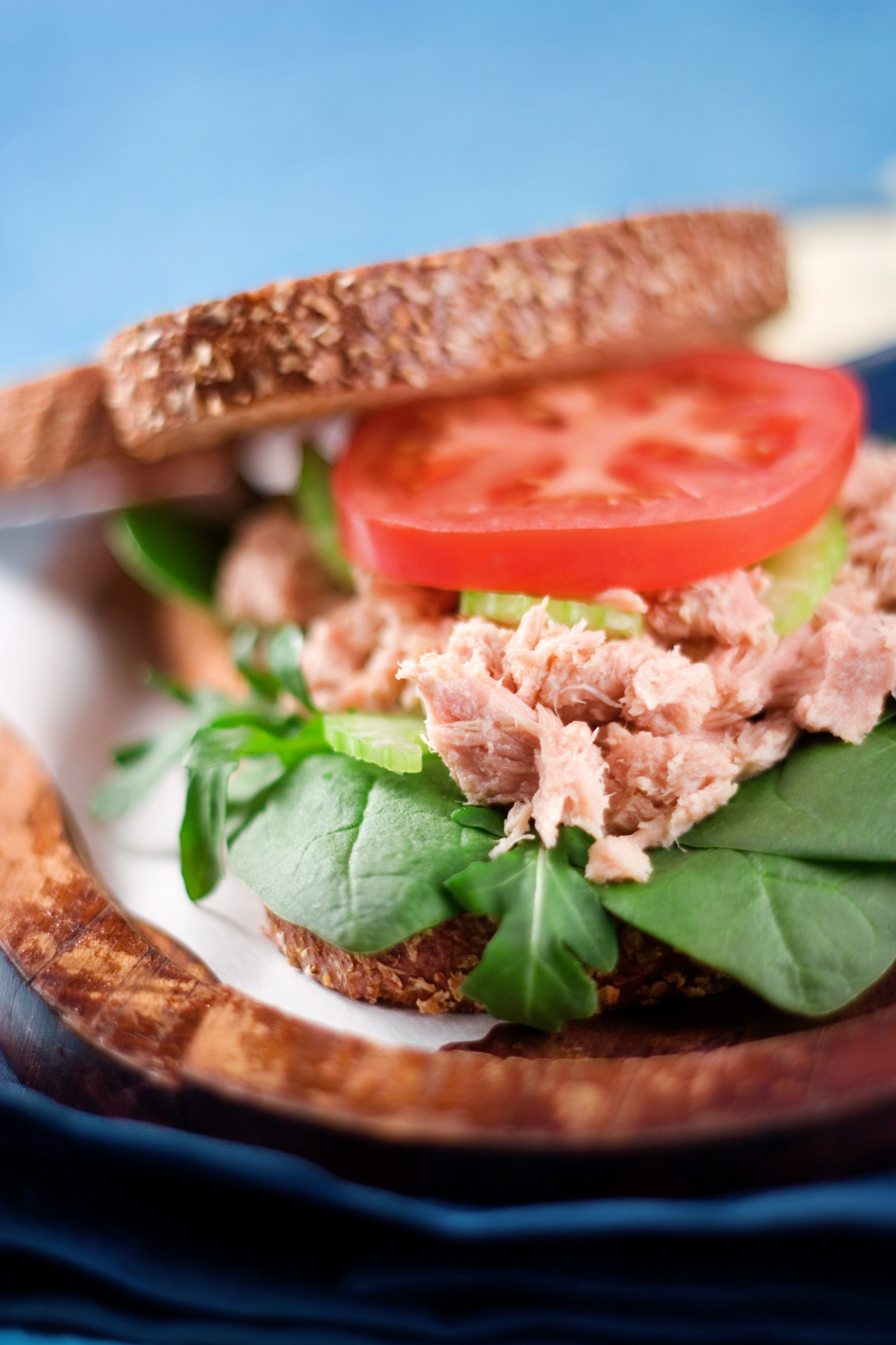 A tuna sandwich with lettuce and tomato