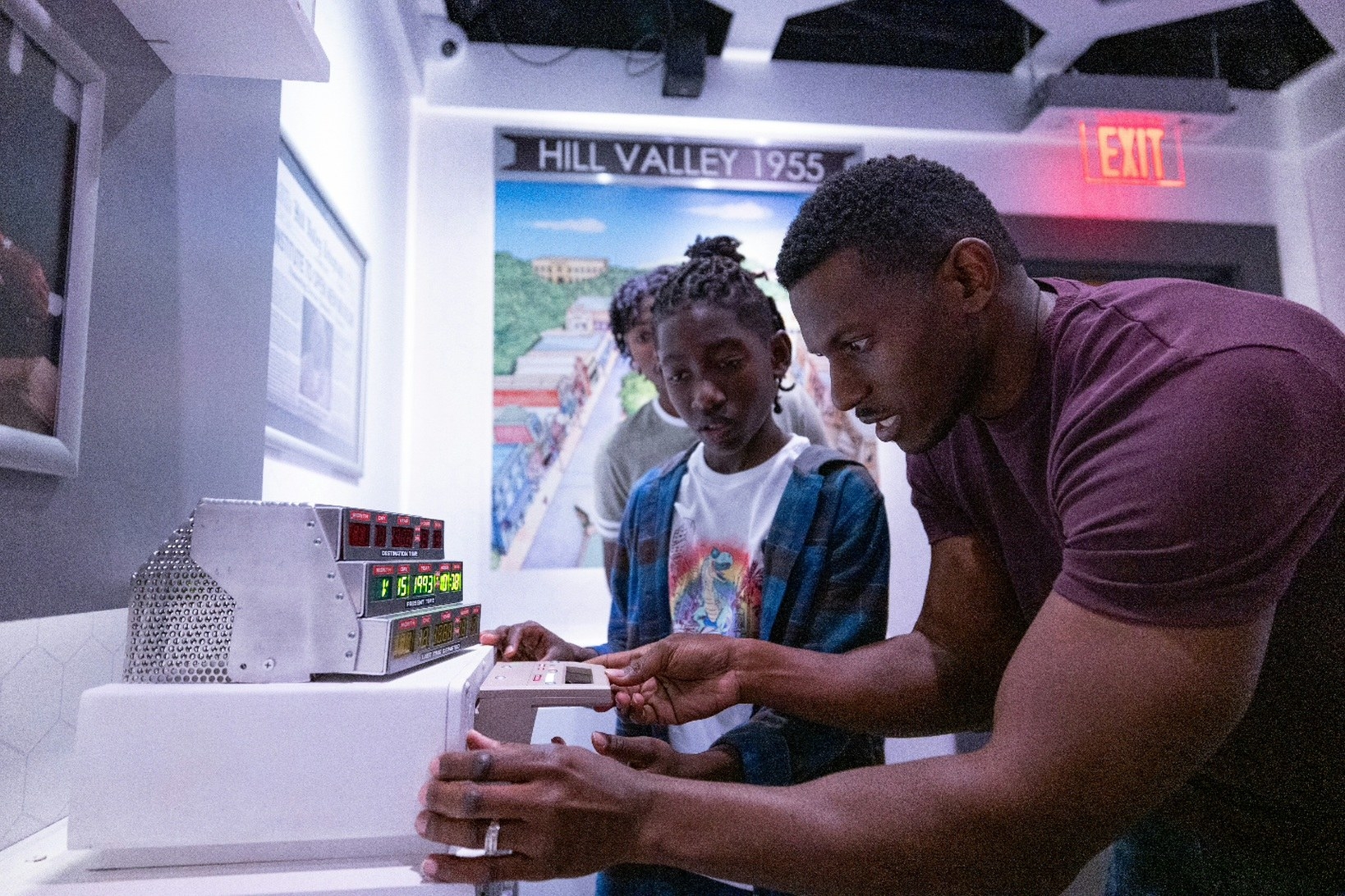 A family tries to solve a puzzle in the Back to the Future escape room at The Great Movie Escape