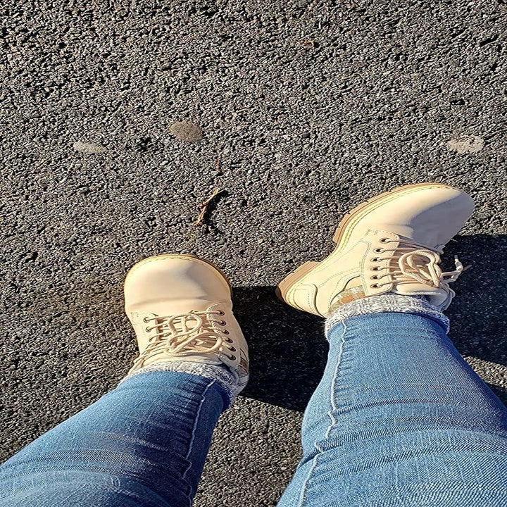 Reviewer wearing cream boots