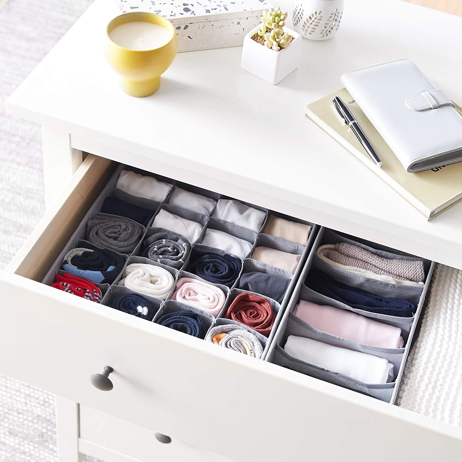 an open drawer with the organizers inside
