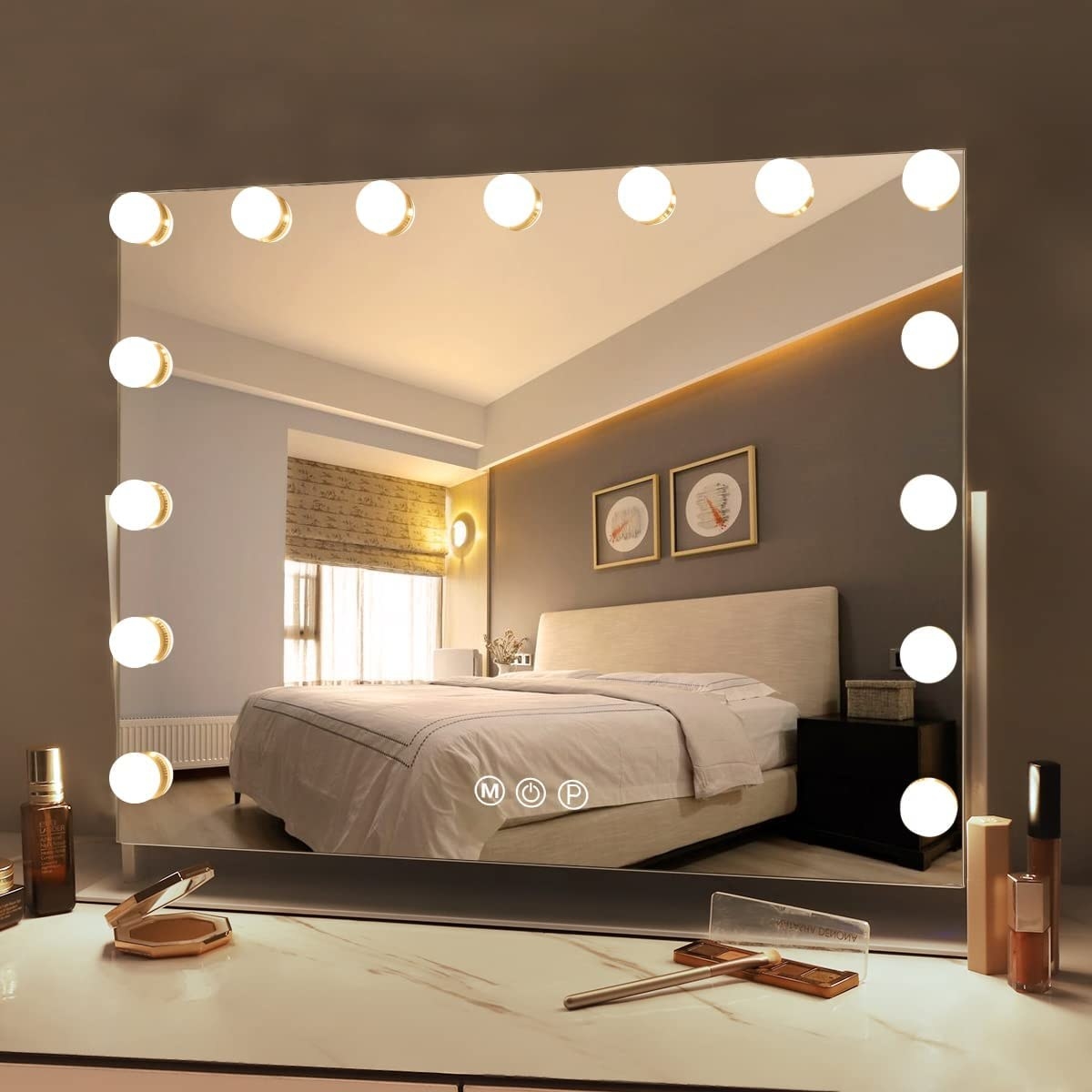 the mirror on top of a vanity in a bedroom