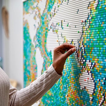 model adds round lego piece to map on wall