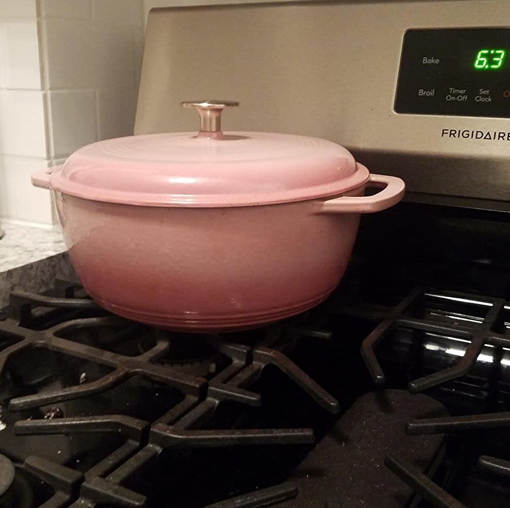 Reviewer image of the pink Dutch oven on a stove