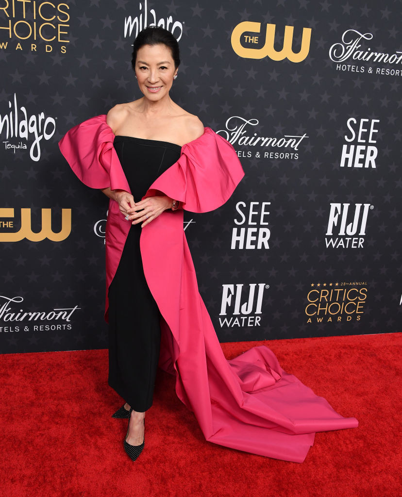 Michelle Yeoh arrives at the 28th Annual Critics Choice Awards in a black and pink gown