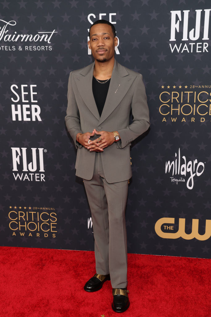 Tyler James Williams attends the 28th Annual Critics Choice Awards in a gray suit