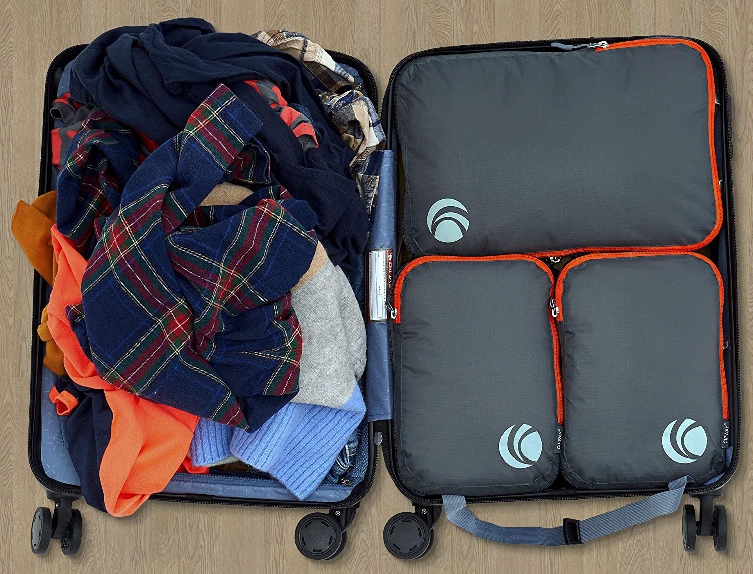 three packing cubes in a stuffed luggage