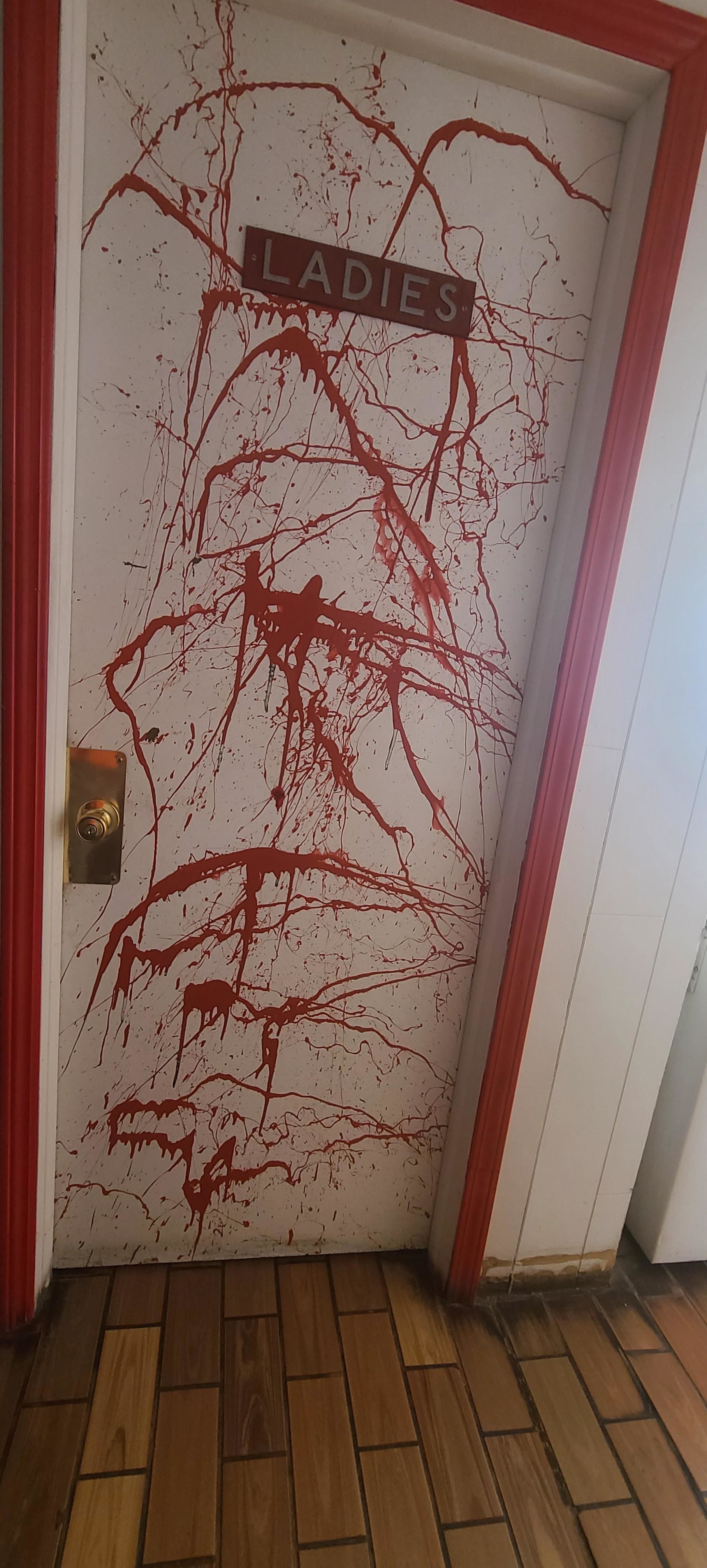 red splash on door that looks bloody