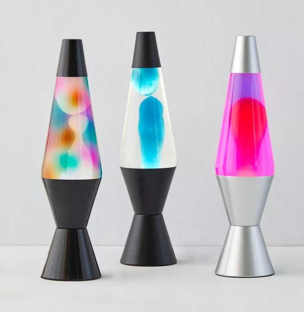 three lava lamps on a surface