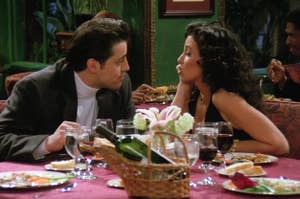Joey and Janice from Friends sitting down to dinner