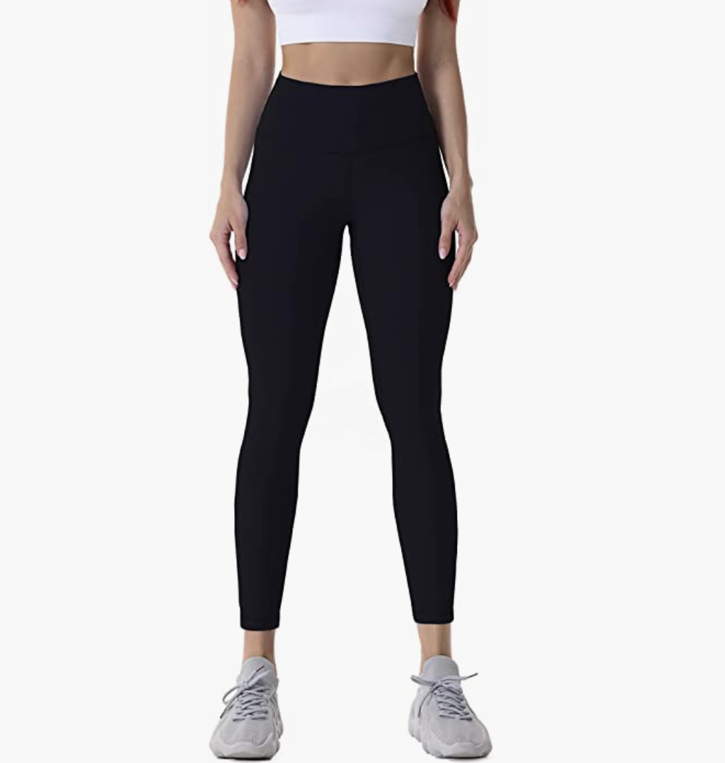a person wearing leggings against a blank background